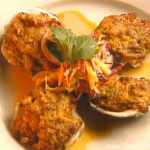 Deviled Oysters with Sour Mango Slaw and Tabasco Butter Sauce