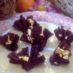 Honey and Hawaiian Vintage Chocolate Ganache with Gold-dusted Chocolate Leaves and Poho Berry Sauce