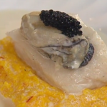 Sea Bass on Grits with Saffron, Oysters, and Caviar-Champagne Sauce