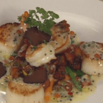 Pan-seared Diver Scallops and Jumbo Gulf Shrimp with Truffle-scented New Potato Hash and Caviar Butter