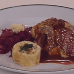 Saddle of Venison in Juniper Cream Sauce au Gratin with Mushrooms, Served with Red Cabbage and Sliced Bread Dumplings