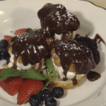 Pecan Profiteroles with Vanilla Ice Cream, Chocolate Sauce,  and Seasonal Fruit